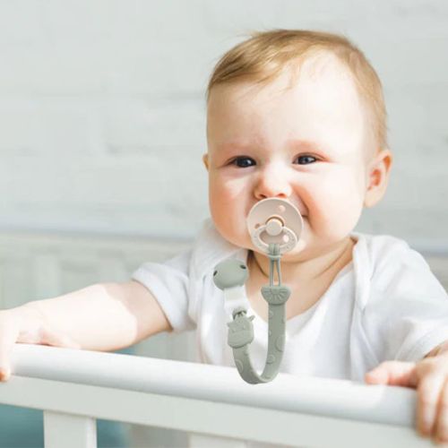 Attache tetine bebe heureux